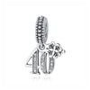 Silver charm featuring the number 40 and a family tree design, set in a beaded bail.