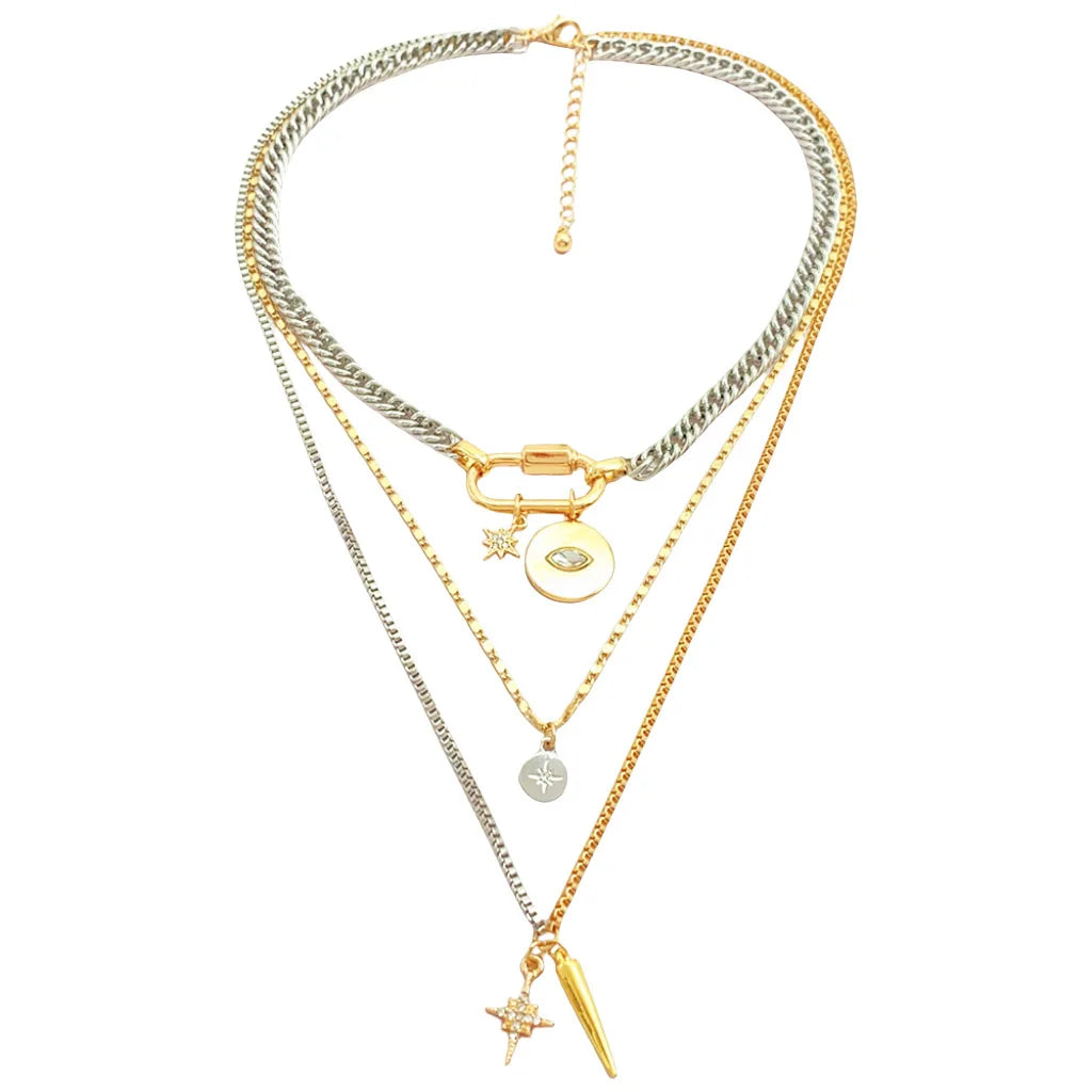 A multilayered gold and silver pendant necklace featuring a star eye charm.