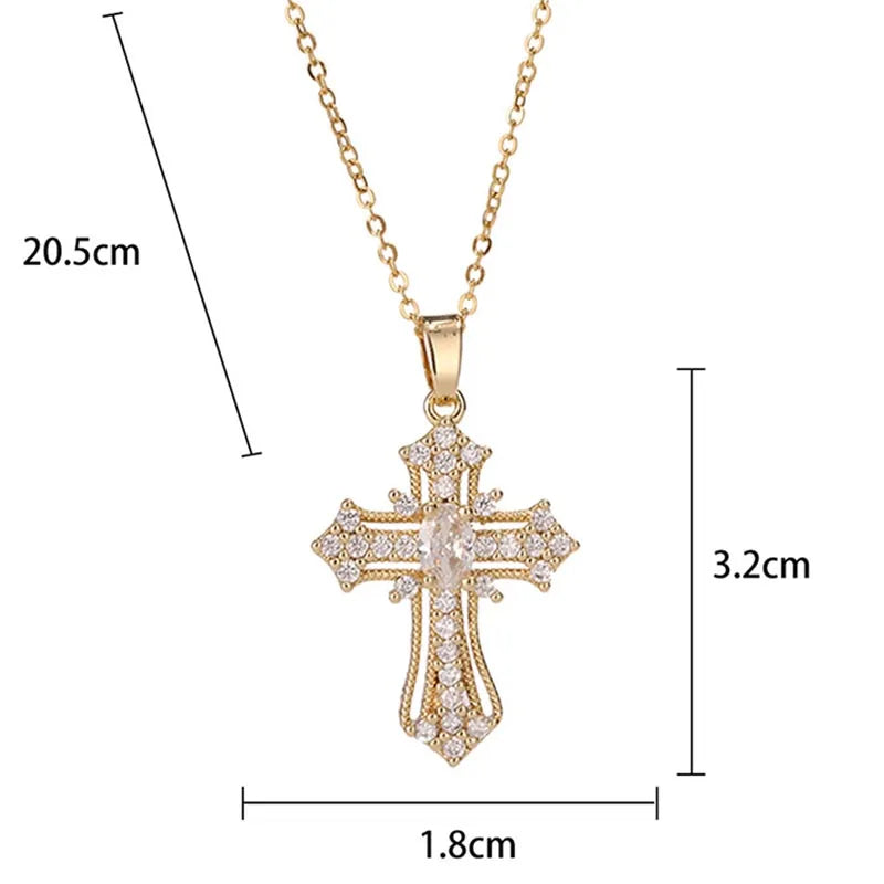 A dainty gold cross charm necklace with a delicate chain and detailed design.