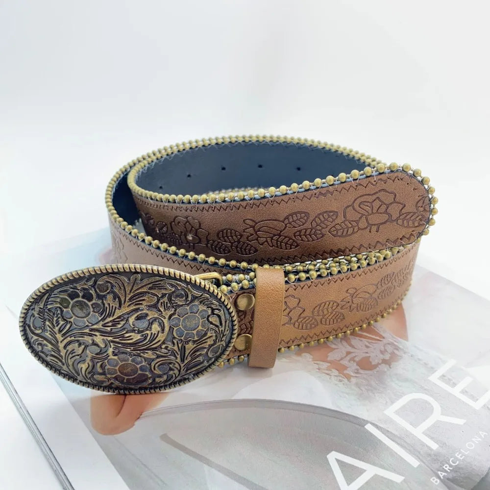 A brown vintage PU leather boho western belt is displayed on a white surface.