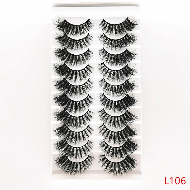 A pair of dramatic mink false eyelashes displayed in a clear packaging.