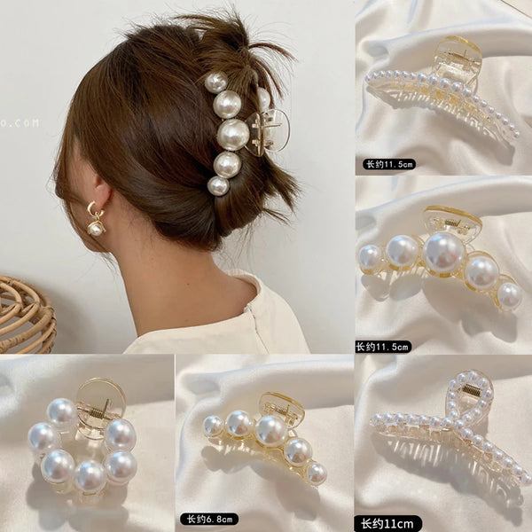 A set of simulated pearl hair claws in various lengths and styles shown against a white background.