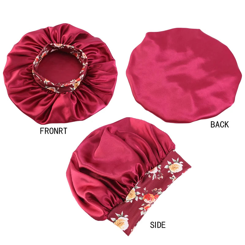 A set of three satin sleep bonnets in deep pink featuring floral embroidery, shown from front, back, and side views.