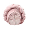 A pink braided turban cap made of soft fabric for African party headwear.