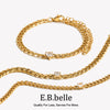 Gold charm bracelet featuring round water drop zircon elements.