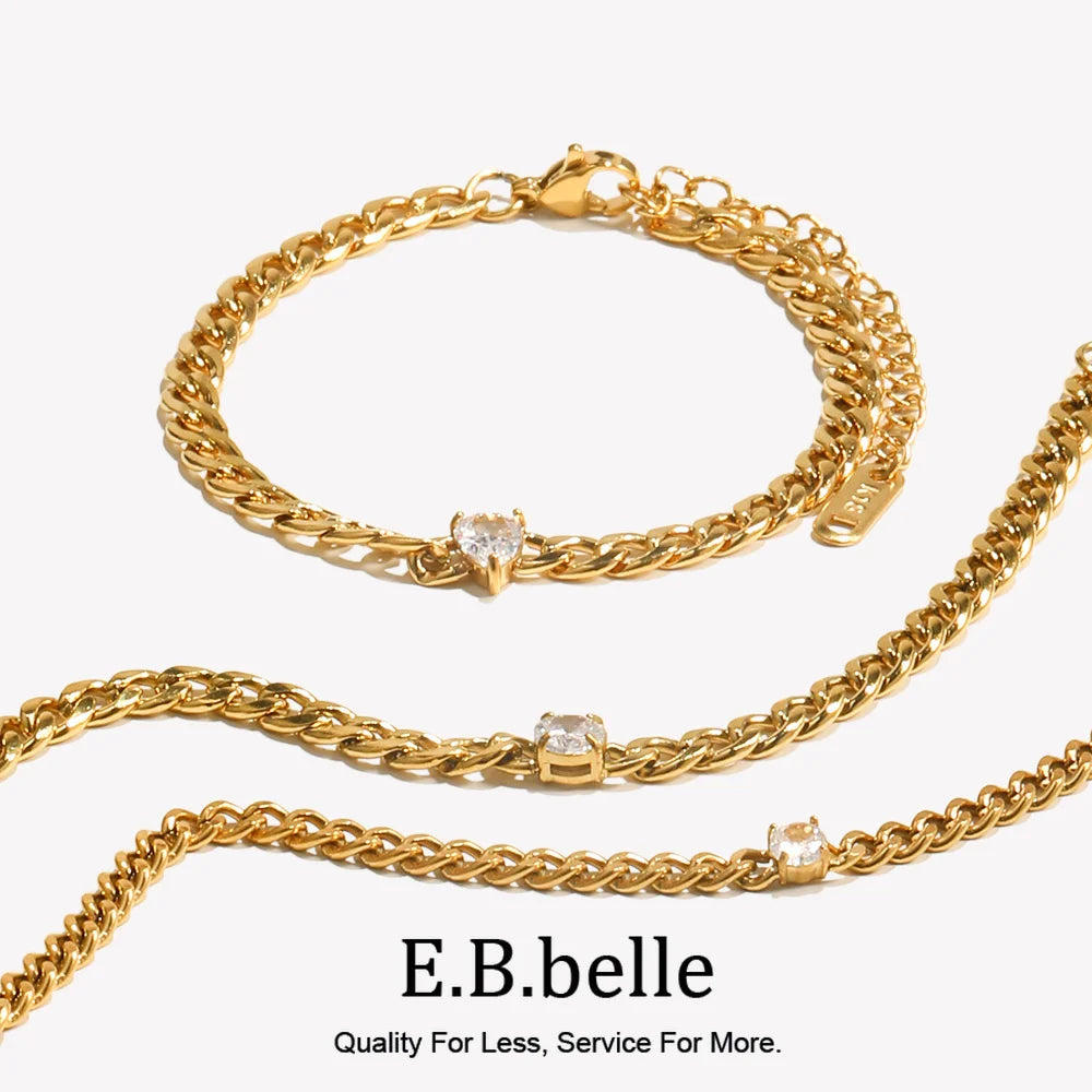 Gold charm bracelet featuring round water drop zircon elements.