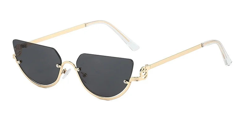 Gafas de estilo ojo de gato retro con marco de oro y lentes oscuros