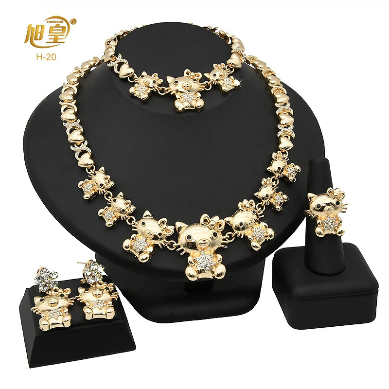 A set of 18K gold heart crystal jewelry for wedding and party, displayed on a black stand.