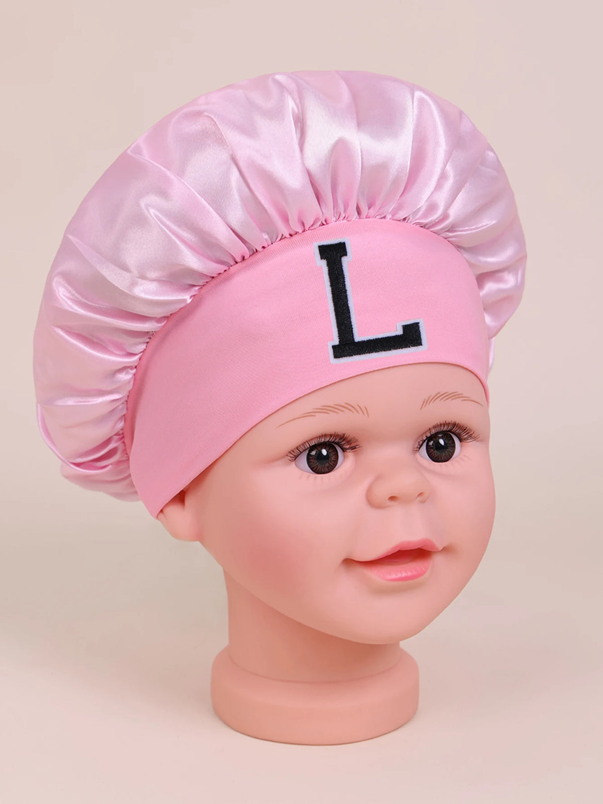 Pink A-Z Letter sleep cap for kids with a large black letter L