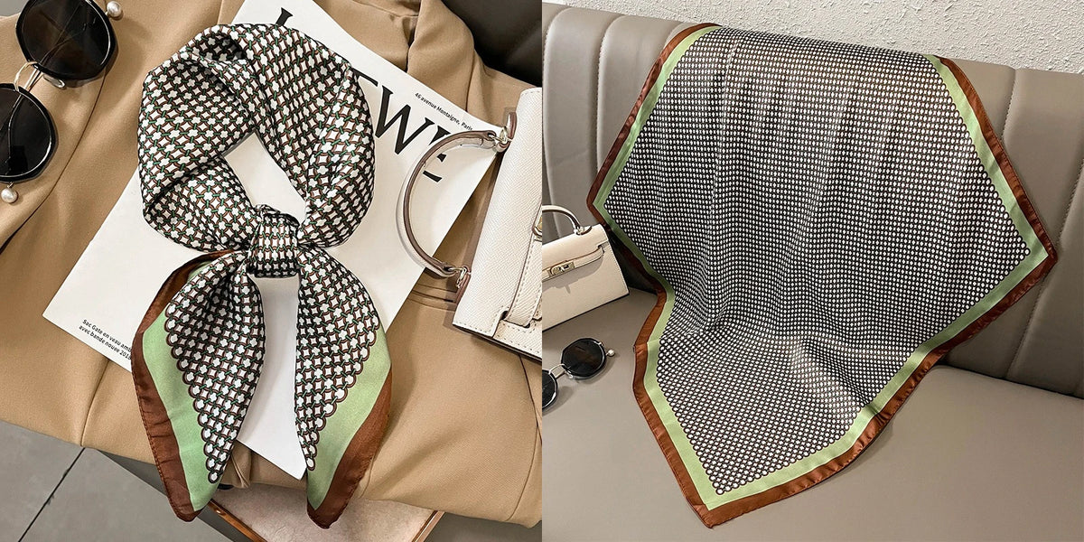 A patterned silk scarf with a floral print is displayed alongside accessories on a beige background.