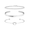 Three gold-plated stainless steel bracelets for women, including a diamond tennis bracelet and two bangle bracelets.
