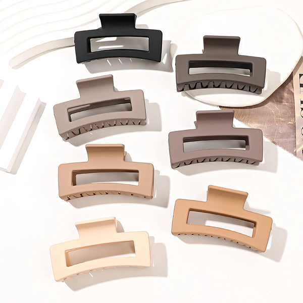 A set of seven square hair claw clips in various beige and gray tones displayed on a white background.
