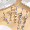 A set of five gold stainless steel dangled belly button rings featuring floral and round diamond-cut stones.