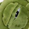 Close-up of a soft green cotton sleep mask showing the interior lining and eye relief design.