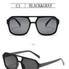 Schwarze und graue Vintage-Pilot-Sonnenbrille, frontal und seitlich dargestellt.