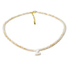 A delicate necklace featuring a Z initial made of mother of pearl with small crystal accents.