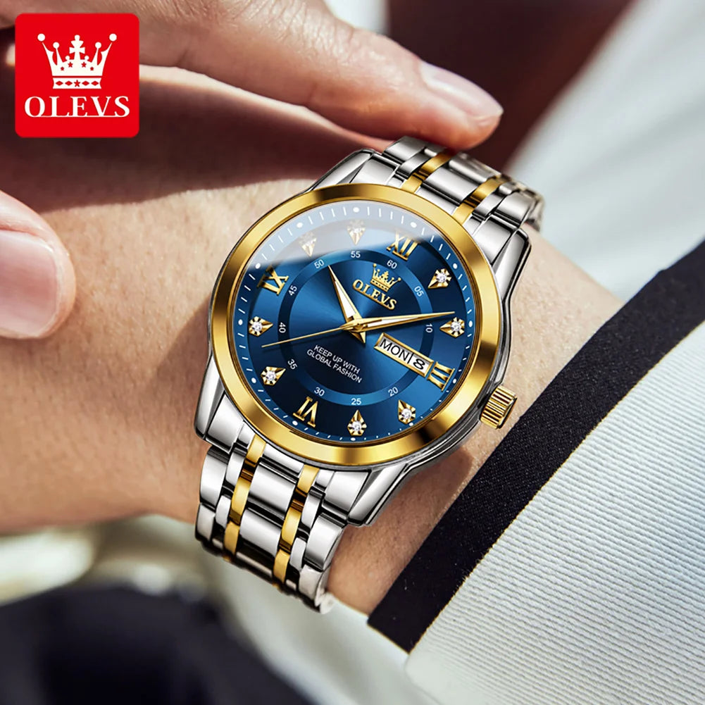 A close-up of a men's stainless steel watch with a blue dial and gold accents worn on a wrist.