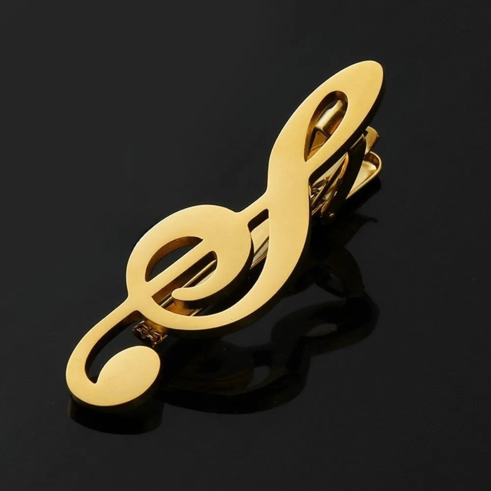 Goldfarbener Titan-Klammer, geformt wie eine Violinschlüssel, für Gitarre und Musikinstrumente.