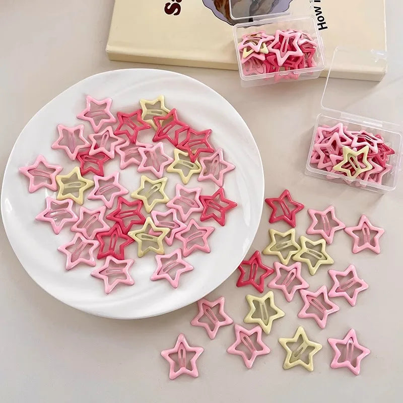 Assortment of pink and yellow star-shaped hair clips for Barrettes