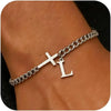 A close-up of a personalized stainless steel cross Cuban chain bracelet worn on a wrist.