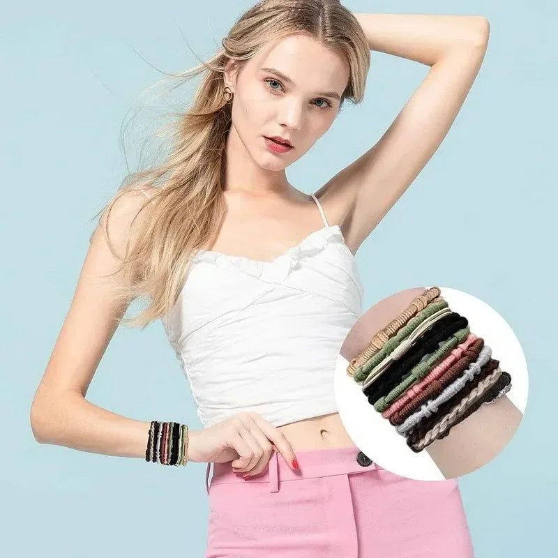 A model shows off boho hair ties and headbands for ponytails, featuring various colored accessories.