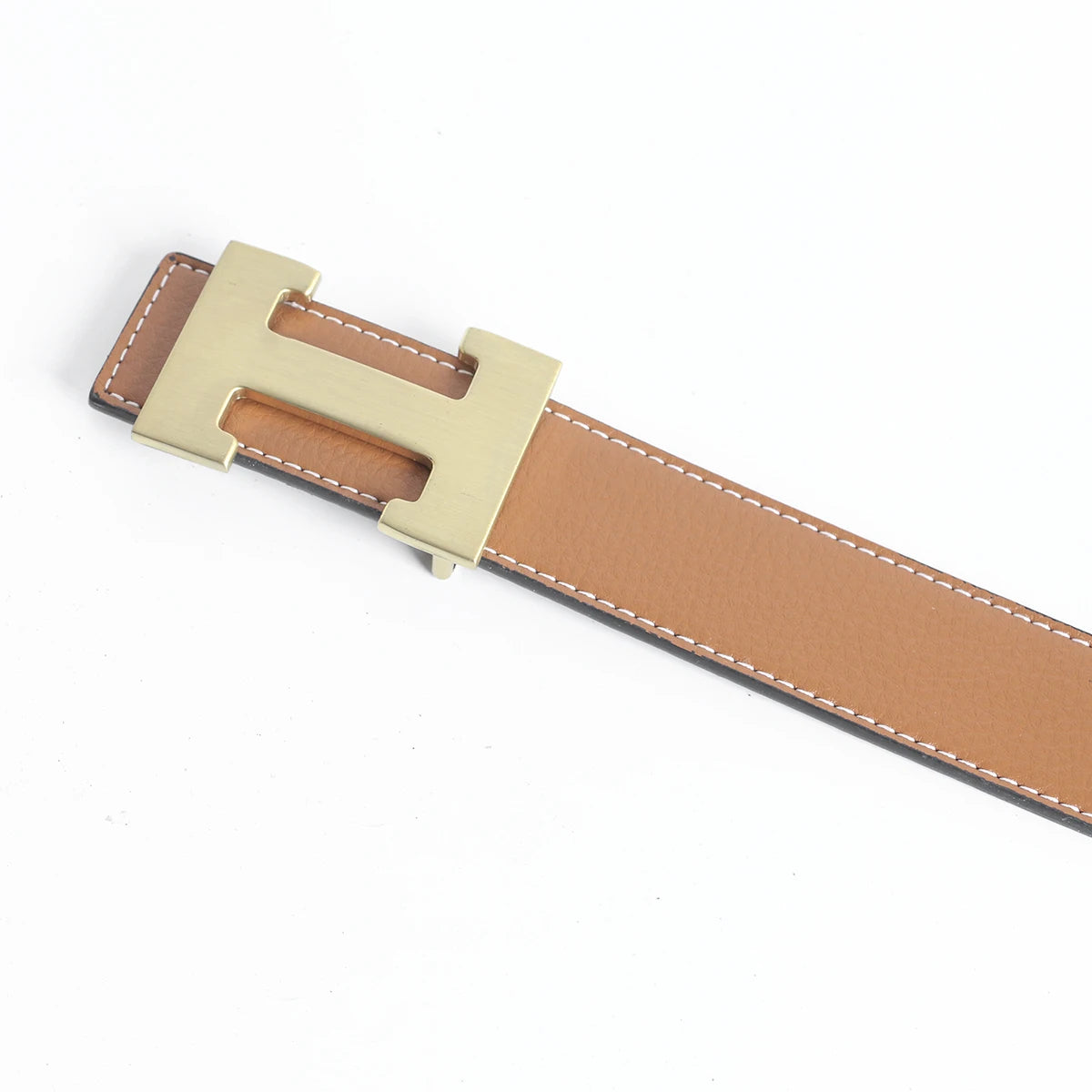 A tan leather dress belt with a brass buckle and stitching, shown diagonally.