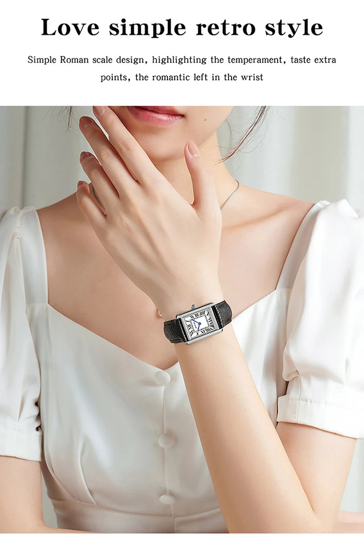 Nahaufnahme einer Frau mit einer silber-schwarzen Quarzwache mit Lederarmband am Handgelenk.