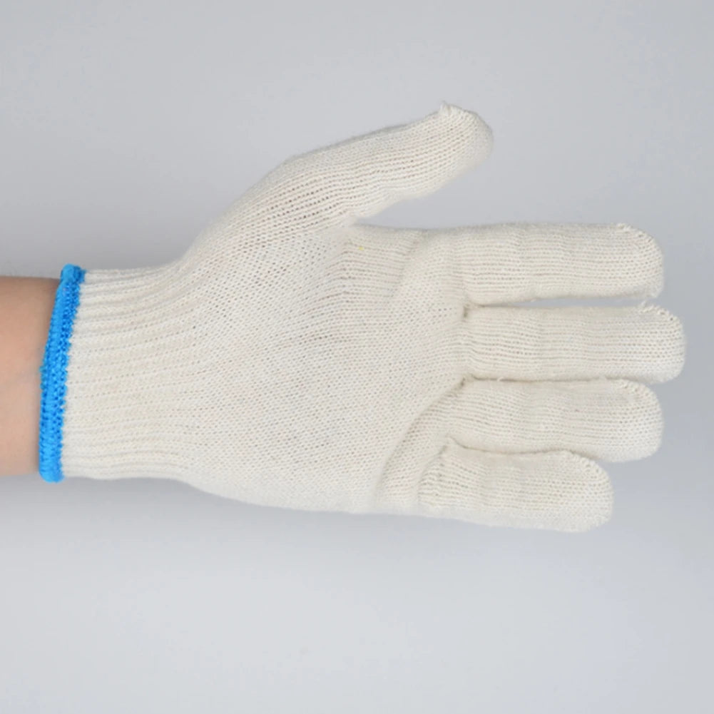 A close-up of a cream-colored cotton thread work glove with blue trim, shown against a white background.