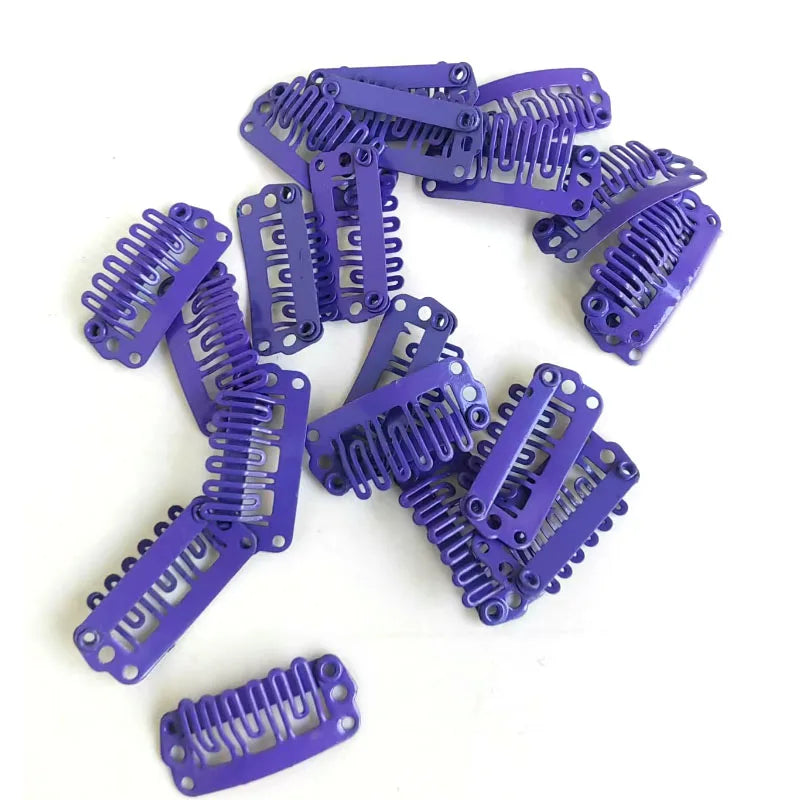A collection of purple precision hair extension clips and barrettes.
