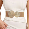 A close-up of a white dress featuring a gold sequin elastic waist belt.