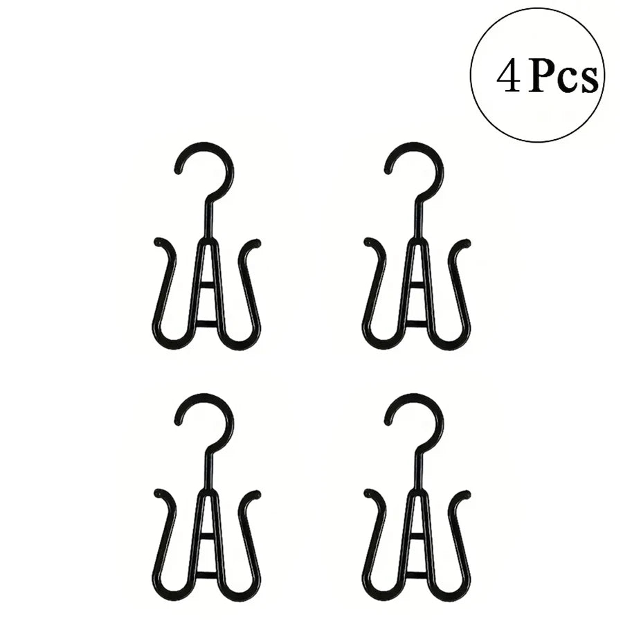 Four black multi-use wig and accessory hangers.
