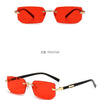 Orange rimless rectangle sunglasses shown in a straight-on view and a 45-degree angle.