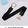 Black adjustable fashion round buckle belt with gold-tone hardware and a light blue fluffy pom-pom.