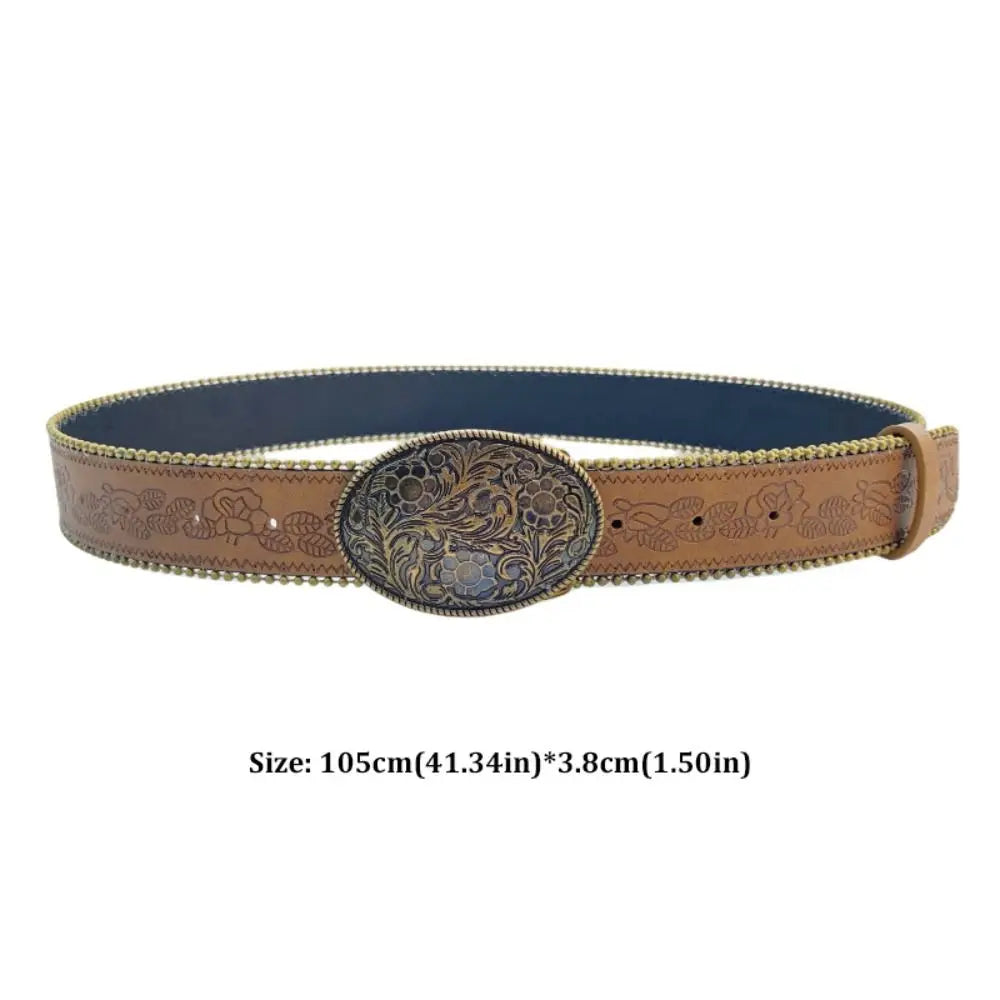 A vintage PU leather boho western belt with an ornate metal buckle and tan leather strap.