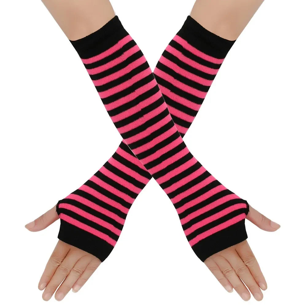 Black and pink striped knitted fingerless gloves worn on a hand