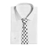 A white dress shirt with a black and white patterned neck tie displayed on a mannequin.