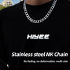A close-up of a silver stainless steel NK chain necklace worn around the neck against a black shirt.