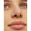 A close-up of a woman's nose featuring a silver faux septum and nose ring set.
