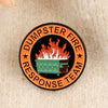 An enamel lapel pin featuring a dumpster fire design with the text DUMPSTER FIRE RESPONSE TEAM on an orange background.