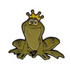 A gold-colored enamel pin featuring a cute frog with a crown and wings.