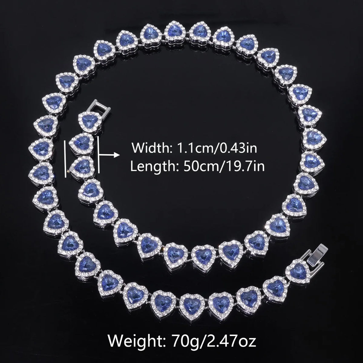A set of sparkling heart rhinestone necklaces and bracelets featuring blue stones, shown against a dark background.