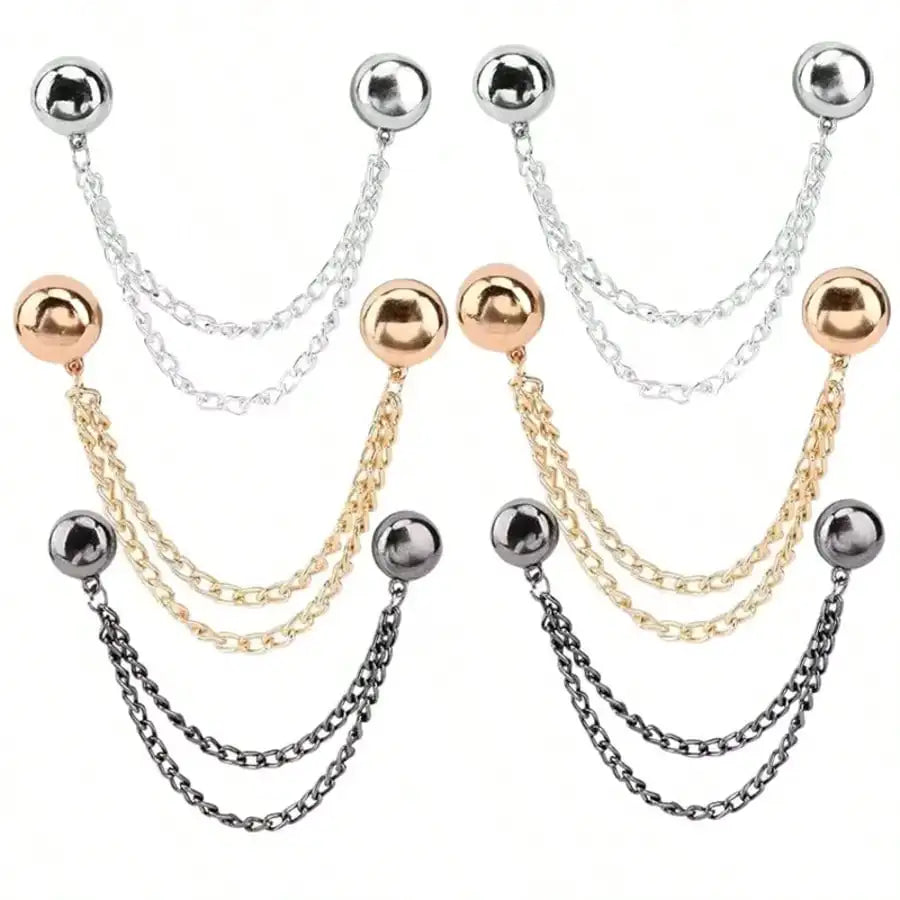 A pair of multi-function magnetic clothing clips with silver and gold chains and spherical beads.