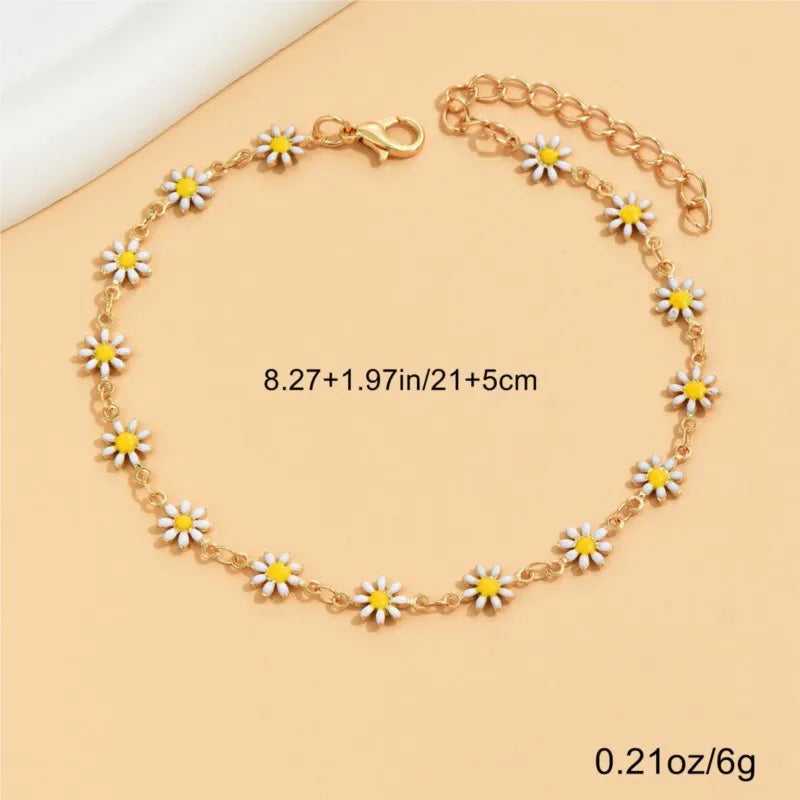 Gold enamel daisy chain anklet measuring 8.27 inches and 5 cm