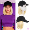 Una mujer modela una gorra de béisbol sintética negra ajustable en su cabeza y la cabeza de un maniquí.