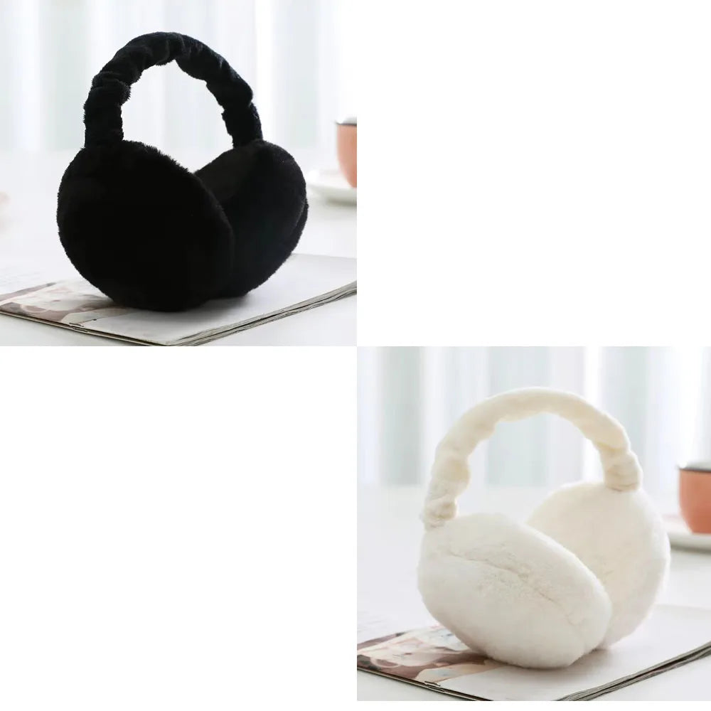 A pair of black plush fur ear warmers or earmuffs resting on a white surface.