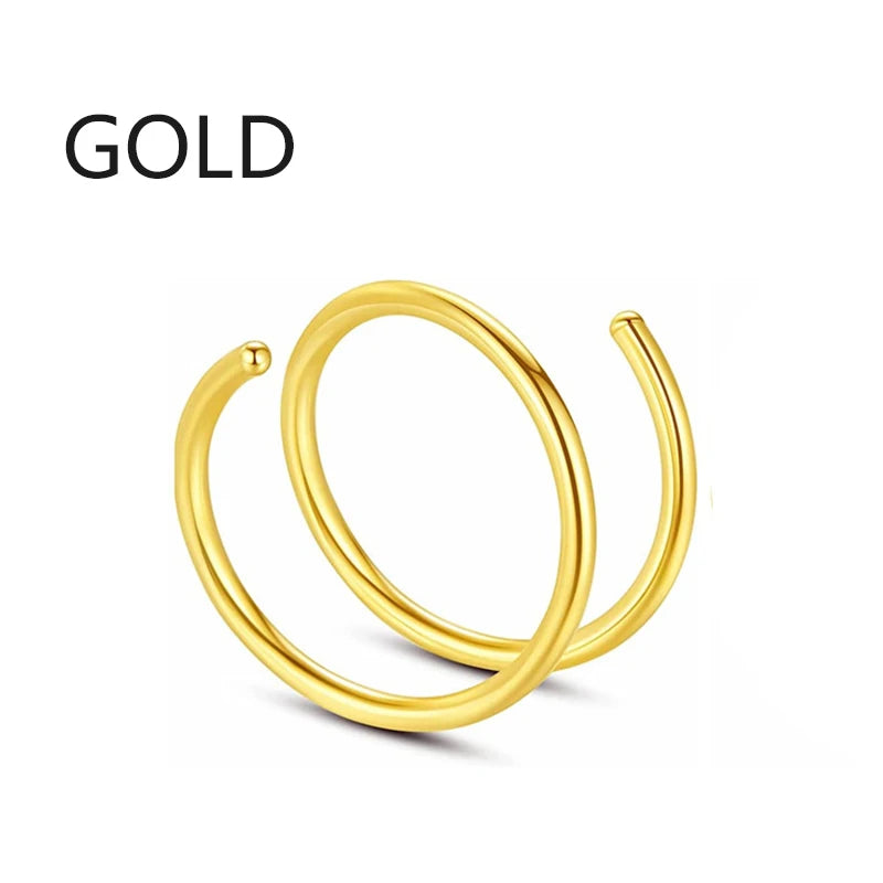 A single gold hoop nose ring jewelry item shown against a white background.