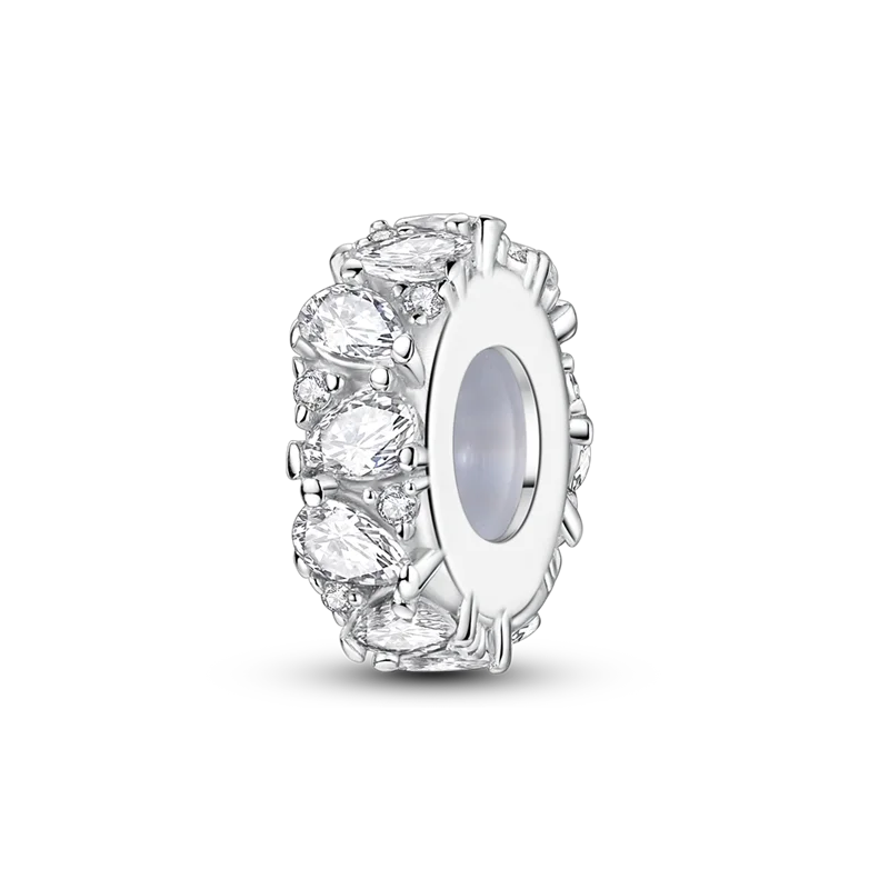 A close-up of a sterling silver devil's eye charm bracelet featuring clear gemstones and intricate detailing.