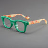 Paire de lunettes de lecture anti-lumière bleue vertes et orange marbrées, montures légères unisexes.