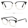 A pair of anti-blue light clear eyeglasses with black frames shown in a studio setting.