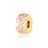 Adorno de cuenta tono dorado con diseños florales y de corazón rosa y piedras brillantes transparentes